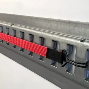 Flat red bungee cords with two double wire hooks in use